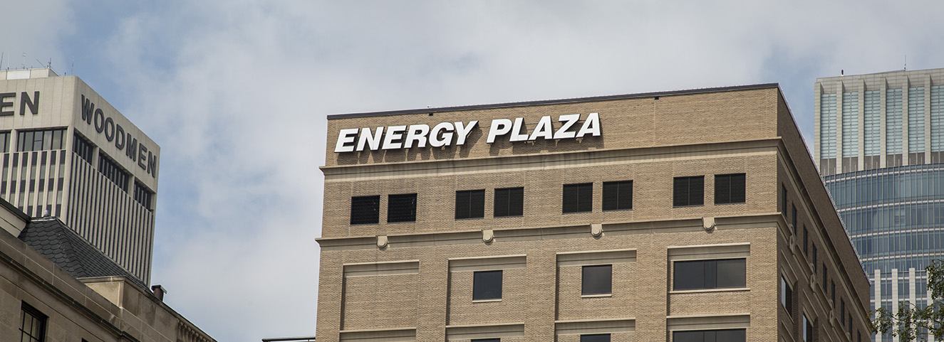 Energy Plaza name plate at top of building