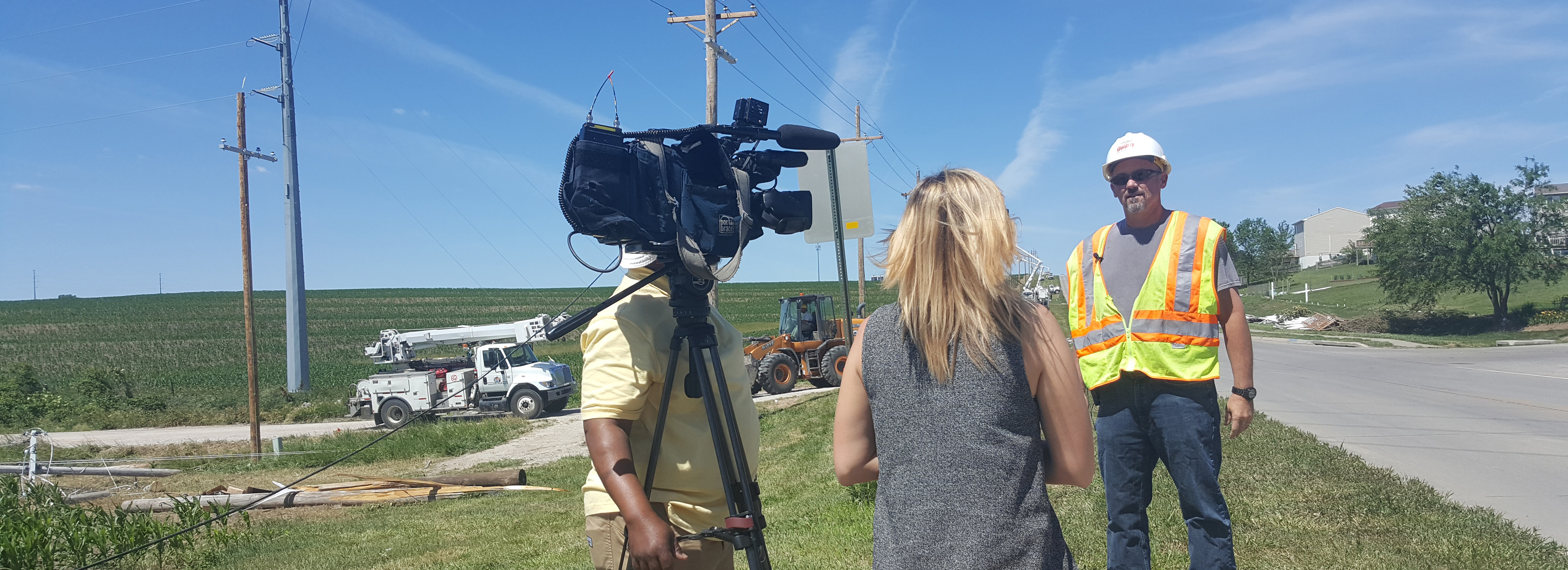 News media interviewing OPPD employee during outage restoration