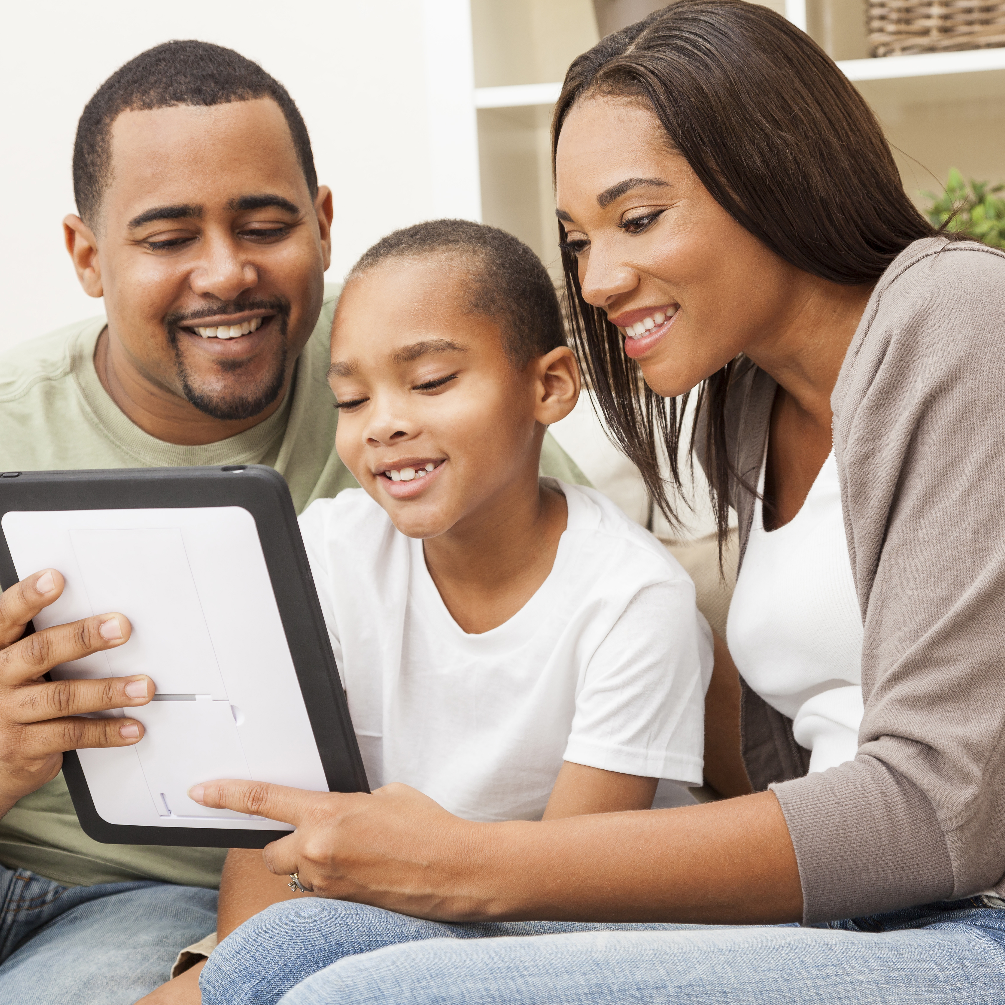 Family looking at tablet