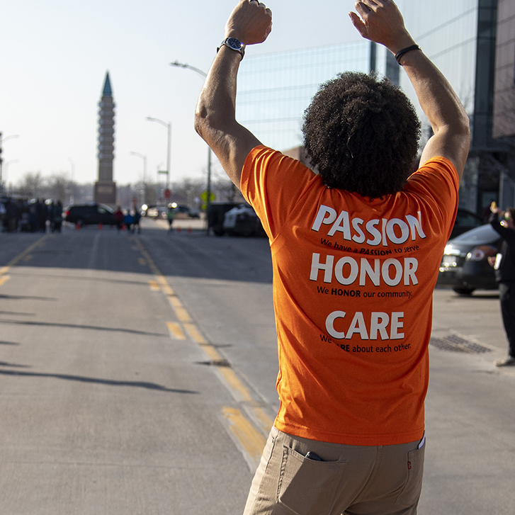 Volunteer cheering at Heat the Streets