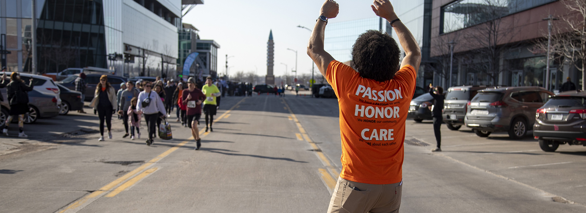 Volunteer cheering at Heat the Streets